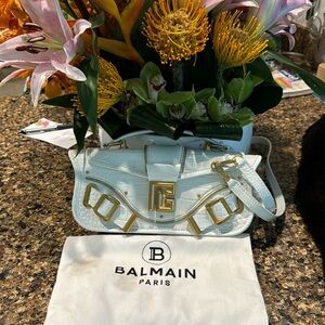 Beautiful white baquette purse with shoulder strap or hand clutch. Gold hardware